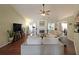 Comfortable living room featuring a fireplace, hardwood floors, and a ceiling fan at 942 Fairmont Park Dr, Dacula, GA 30019