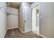 Walk in closet with wire shelving and carpet; entry into a bathroom visible through the doorway at 4604 Eastbrook Pl, Snellville, GA 30039