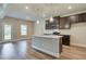 Beautiful kitchen with dark wood cabinets, granite countertops, and modern appliances at 4604 Eastbrook Pl, Snellville, GA 30039