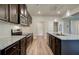 Well-lit kitchen featuring stainless steel appliances and dark wood cabinets, topped with granite countertops at 4604 Eastbrook Pl, Snellville, GA 30039