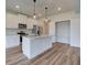 Modern kitchen with white cabinets, stainless steel appliances, and a large island at 4604 Eastbrook Pl, Snellville, GA 30039