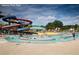 Lenora Park pool with slides and people swimming at 4604 Eastbrook Pl, Snellville, GA 30039