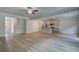 Open-concept living room features luxury vinyl plank flooring and neutral-toned kitchen at 4604 Eastbrook Pl, Snellville, GA 30039