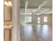 Inviting living space featuring hardwood floors, coffered ceilings, and ample natural light, perfect for relaxation and entertaining at 4604 Eastbrook Pl, Snellville, GA 30039