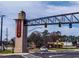 Snellville entrance sign over the road with a brick tower and banner at 4604 Eastbrook Pl, Snellville, GA 30039