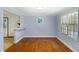 Bright dining room with hardwood floors, bar seating and windows providing natural light at 6464 Westerly Way, Douglasville, GA 30135