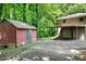 Exterior shot of detached garage with carport next to storage shed at 6464 Westerly Way, Douglasville, GA 30135