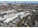 Aerial view of apartments, townhomes, and detached houses with a cityscape in the background at 77 Krog Ne St, Atlanta, GA 30307