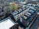 Aerial view of modern townhome construction, with rooftop patios and balconies on each home at 77 Krog Ne St, Atlanta, GA 30307