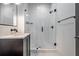 Stylish bathroom featuring subway tile shower, modern vanity, and elegant fixtures at 77 Krog Ne St, Atlanta, GA 30307