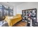 Bright bedroom features large windows with plenty of light, hardwood floors, and a fun bookcase at 77 Krog Ne St, Atlanta, GA 30307