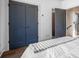 Bedroom featuring hardwood floors, grey doors and white walls at 77 Krog Ne St, Atlanta, GA 30307