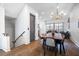 Elegant dining area with hardwood floors, chandelier lighting, and open living concept at 77 Krog Ne St, Atlanta, GA 30307