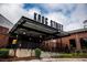 Entrance to Krog Street Market, a converted warehouse, featuring rustic brick and industrial design at 77 Krog Ne St, Atlanta, GA 30307