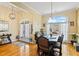 Dining room features hardwood floors and a large window with natural light at 9620 Coastal Pointe Dr, Villa Rica, GA 30180