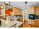 Bright kitchen featuring honey colored cabinets, stainless steel appliances and views to another living space at 9620 Coastal Pointe Dr, Villa Rica, GA 30180