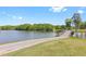 Scenic view of the community pond and surrounding landscape, with a small bridge in the distance at 9620 Coastal Pointe Dr, Villa Rica, GA 30180