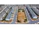 Aerial view of the neighborhood featuring the swimming pool, grassy field and townhomes at 112 Calder Dr, Alpharetta, GA 30009