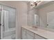 Bright bathroom featuring a vanity with ample counter space and a tub with shower at 112 Calder Dr, Alpharetta, GA 30009