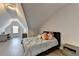 Attic bedroom with a sloped ceiling, neutral color scheme, and a cozy study area at 112 Calder Dr, Alpharetta, GA 30009