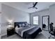 Bedroom with neutral gray walls, a ceiling fan, and a cozy, well-made bed at 112 Calder Dr, Alpharetta, GA 30009