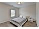 Cozy bedroom with natural light, minimalist decor, and hardwood flooring at 112 Calder Dr, Alpharetta, GA 30009