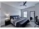 Bedroom featuring a comfortable bed with a stylish headboard and a ceiling fan at 112 Calder Dr, Alpharetta, GA 30009