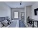 Bright bedroom featuring a stylish bed, modern decor, and hardwood floors at 112 Calder Dr, Alpharetta, GA 30009