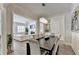 Dining room with an elegant chandelier and a view of the living room at 112 Calder Dr, Alpharetta, GA 30009