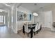 Elegant dining room with chandelier, modern decor, and ample seating at 112 Calder Dr, Alpharetta, GA 30009