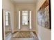 Light and airy entryway with hardwood floors and a decorative mirror at 112 Calder Dr, Alpharetta, GA 30009