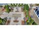 Outdoor patio features a brick fireplace, mature trees, and additional landscaping at 112 Calder Dr, Alpharetta, GA 30009