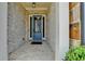 Close-up of a blue front door framed by brick and white pillars at 112 Calder Dr, Alpharetta, GA 30009