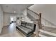 Upstairs hallway featuring hardwood floors, a black futon, and staircase at 112 Calder Dr, Alpharetta, GA 30009