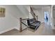 Hallway featuring hardwood floors, black metal stair rails, and a black futon at 112 Calder Dr, Alpharetta, GA 30009