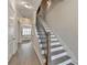 Hallway with hardwood floors and stairs with iron railing at 112 Calder Dr, Alpharetta, GA 30009