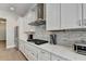 Kitchen featuring white cabinets, subway tile backsplash, stainless steel appliances and an island at 112 Calder Dr, Alpharetta, GA 30009