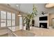 Bright kitchen featuring an island with sink, shutters, and open view to the living area at 112 Calder Dr, Alpharetta, GA 30009