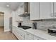 Kitchen features stainless steel appliances, white cabinets, and cooktop at 112 Calder Dr, Alpharetta, GA 30009