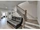 Modern living room area featuring a staircase and a comfortable seating area at 112 Calder Dr, Alpharetta, GA 30009