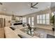 Bright living room with hardwood floors, neutral colors and an open floor plan into the kitchen at 112 Calder Dr, Alpharetta, GA 30009