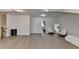 Large living room featuring hardwood floors and multiple entryways for convenience at 112 Calder Dr, Alpharetta, GA 30009