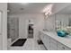 A luxurious main bathroom featuring a glass-enclosed shower, double vanity, and a walk-in closet at 112 Calder Dr, Alpharetta, GA 30009