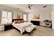 A spacious main bedroom featuring hardwood floors, shutters, a ceiling fan, and a piano at 112 Calder Dr, Alpharetta, GA 30009