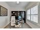 Home office featuring hardwood floors, a modern desk, and a built-in bookcase at 112 Calder Dr, Alpharetta, GA 30009