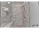 Large walk-in shower with bench and light gray marble-look tiles at 112 Calder Dr, Alpharetta, GA 30009