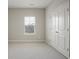 Neutral bedroom with carpet, a window with blinds, and a double-door closet at 2471 Arnold Palmer Way, Duluth, GA 30096