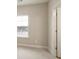 Bedroom with neutral walls, carpeting, natural light, and view to the hallway at 2471 Arnold Palmer Way, Duluth, GA 30096