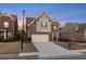 Charming two-story home with a two-car garage and well-maintained lawn at dusk at 2471 Arnold Palmer Way, Duluth, GA 30096