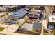 Aerial view showcasing the community with restaurants, retail, outdoor games, a fountain, and pedestrian walkways at 385 Rowes Cir, Alpharetta, GA 30009